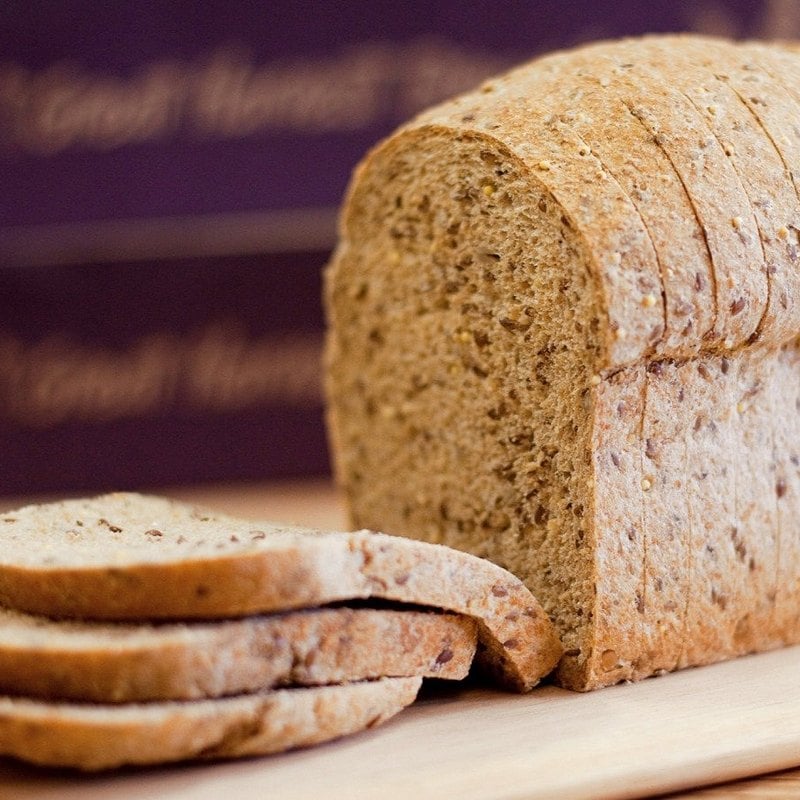 whole grain bread sliced on a cutting board